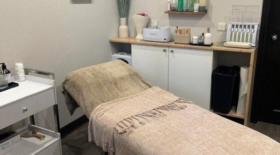 Cozy treatment room at Butterfly Beauty, Elgin, Scotland, GB featuring a massage table with warm tones.