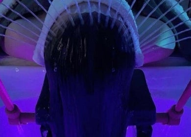 Relaxing purple-lit hair wash at Butterfly Beauty, Elgin, Scotland, GB.