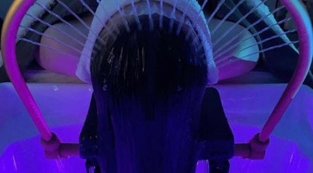 Relaxing purple-lit hair wash at Butterfly Beauty, Elgin, Scotland, GB.