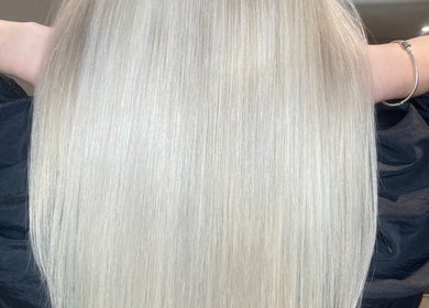 Sleek blonde hair at Shades, Dereham, England, GB, showcasing expert styling and shine.
