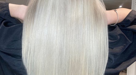 Sleek blonde hair at Shades, Dereham, England, GB, showcasing expert styling and shine.