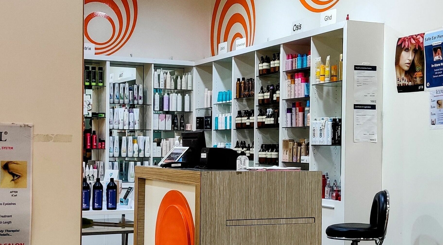 Stylish interior of Kess Hair & Beauty St. Lukes, Auckland. Shelves with diverse hair and beauty products.