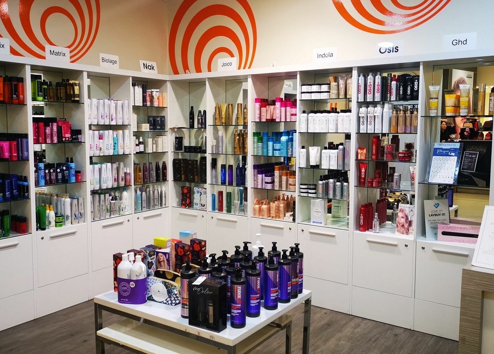 Diverse haircare selection at Kess Hair & Beauty St. Lukes, Auckland, Auckland, NZ. Colorful products line the shelves.