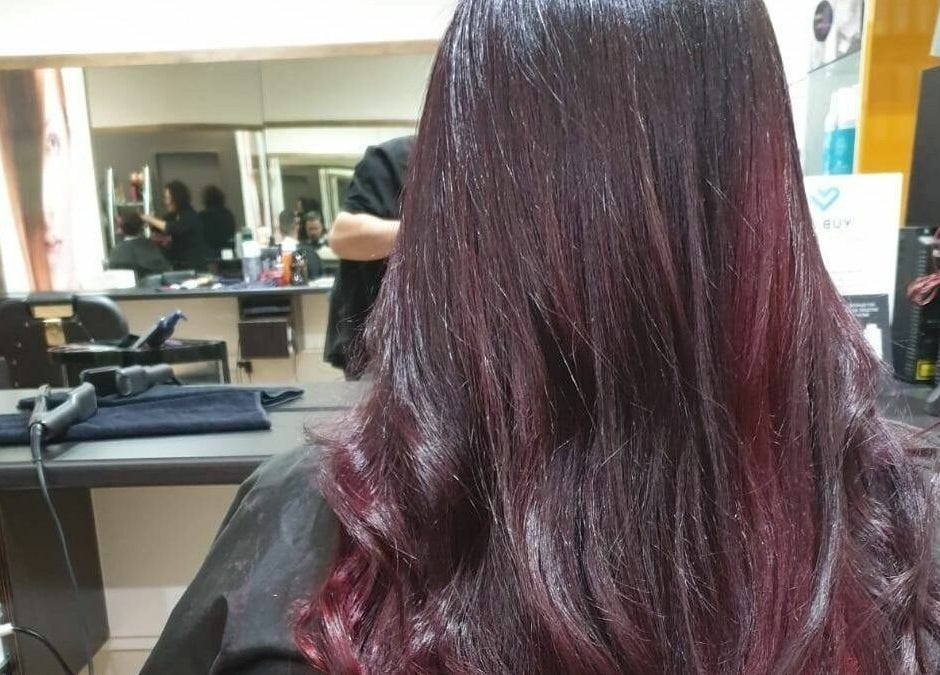 A stylish salon view at Kess Hair & Beauty St. Lukes in Auckland, Auckland, NZ, showcasing vibrant hair color.