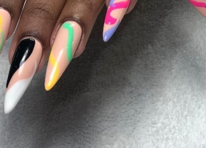 Colorful nail art from Day and Night Beauty in Kingston, St. Andrew Parish, JM. Features bold, vibrant designs.