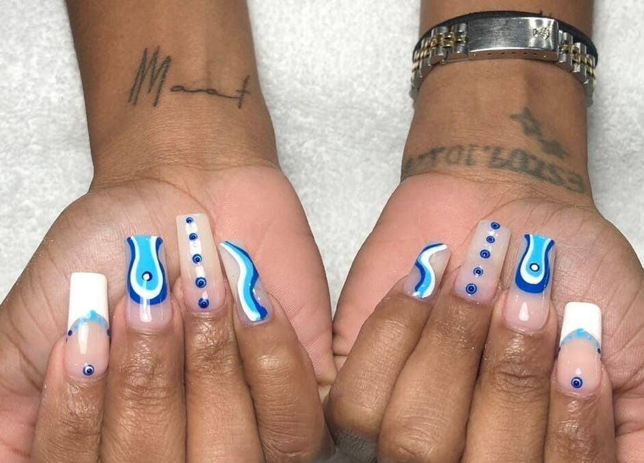 Stylish blue wave nail art at Day and Night Beauty, Kingston, St. Andrew Parish, JM.