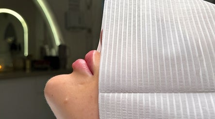 Client receiving a beauty treatment at Enhanced Aesthetics Lashes Beauty, Bangor, Wales, GB.