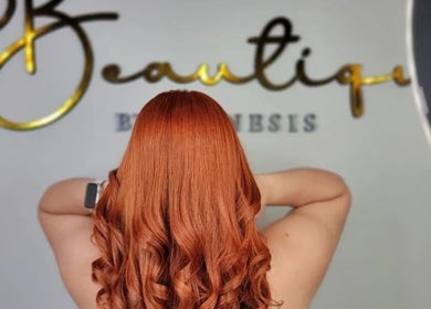 Elegant red hair styled in waves at Beautique by Genesis, Mayagüez, Mayagüez, PR.