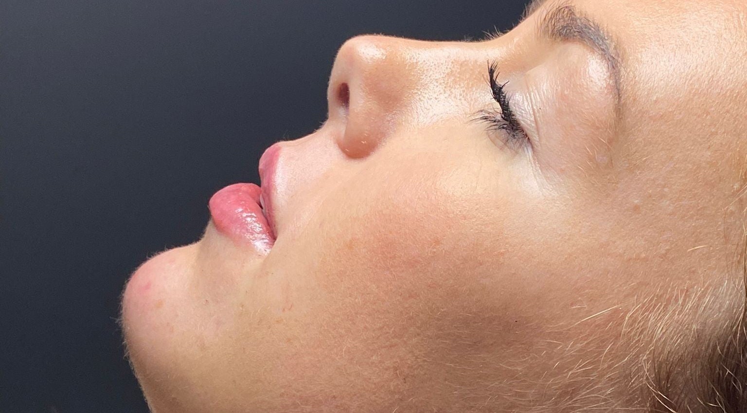 Relaxed woman's profile at Lucys Beauty Lounge, Addlestone, England, GB, epitomizing tranquility.