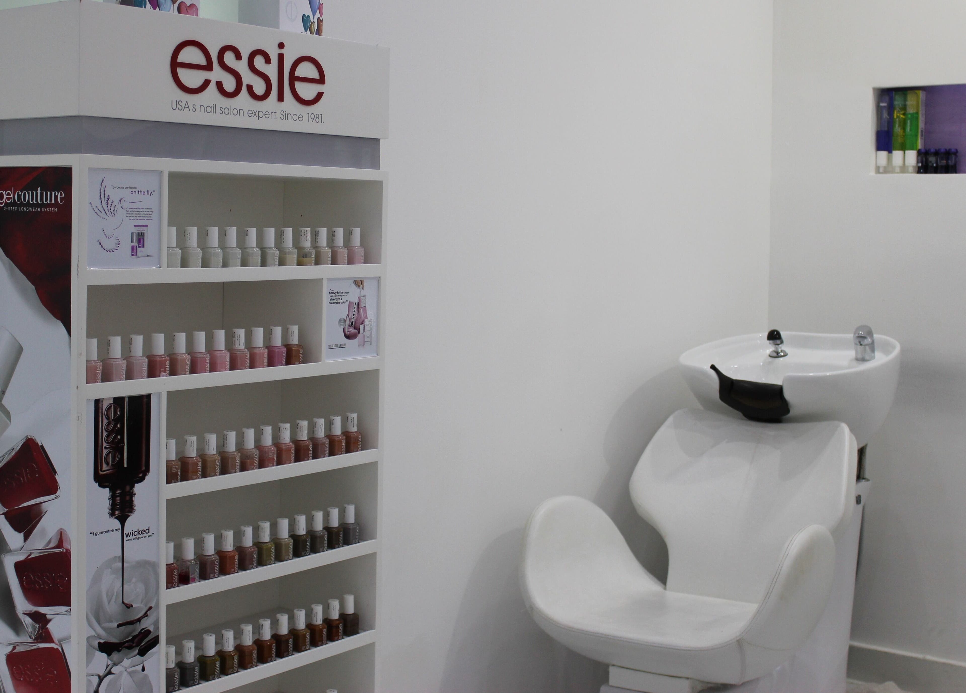 Essie nail polish display beside styling chair at Tip Top Nails Bar Al Manzil, دبي, دبي, AE.