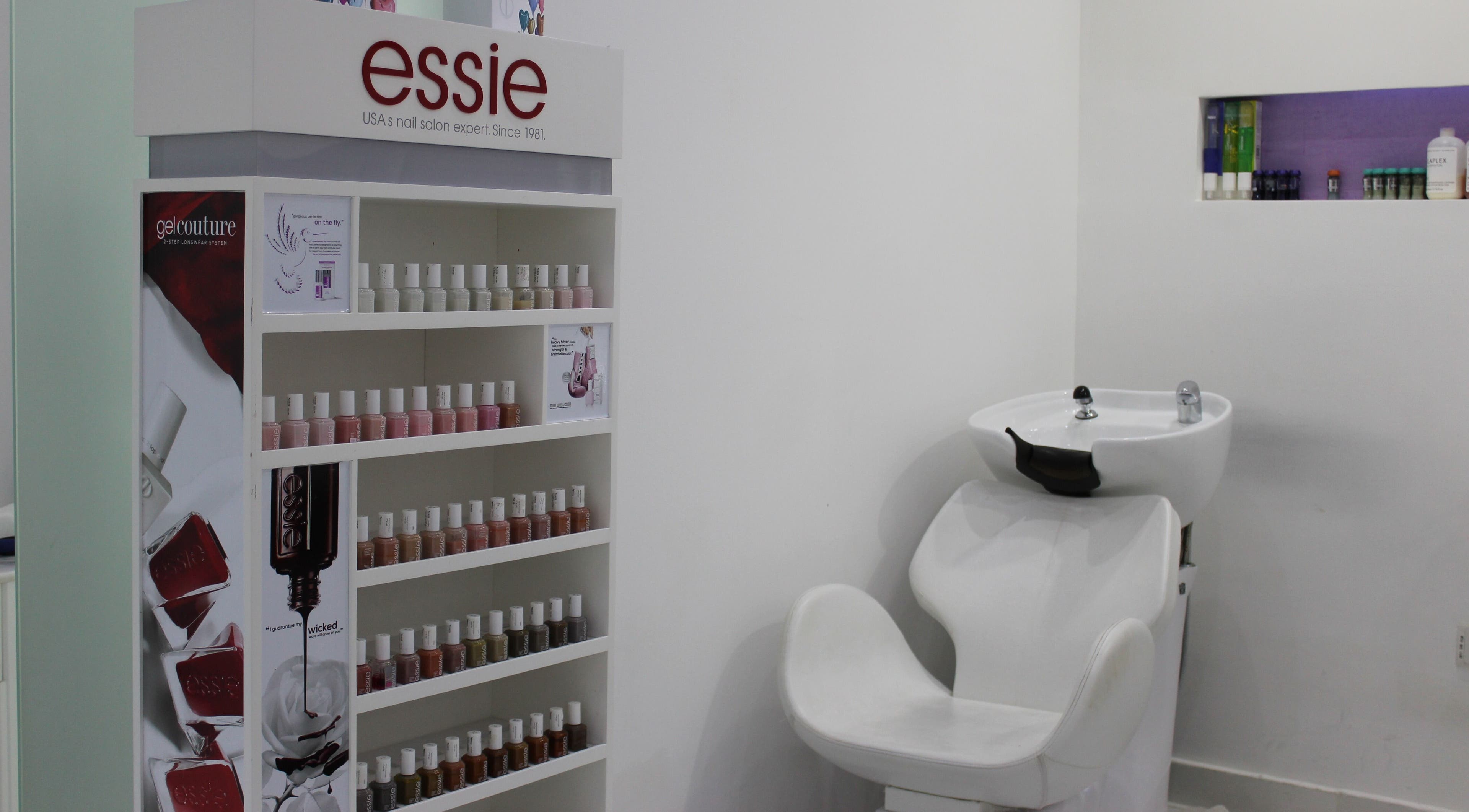 Essie nail polish display beside styling chair at Tip Top Nails Bar Al Manzil, دبي, دبي, AE.