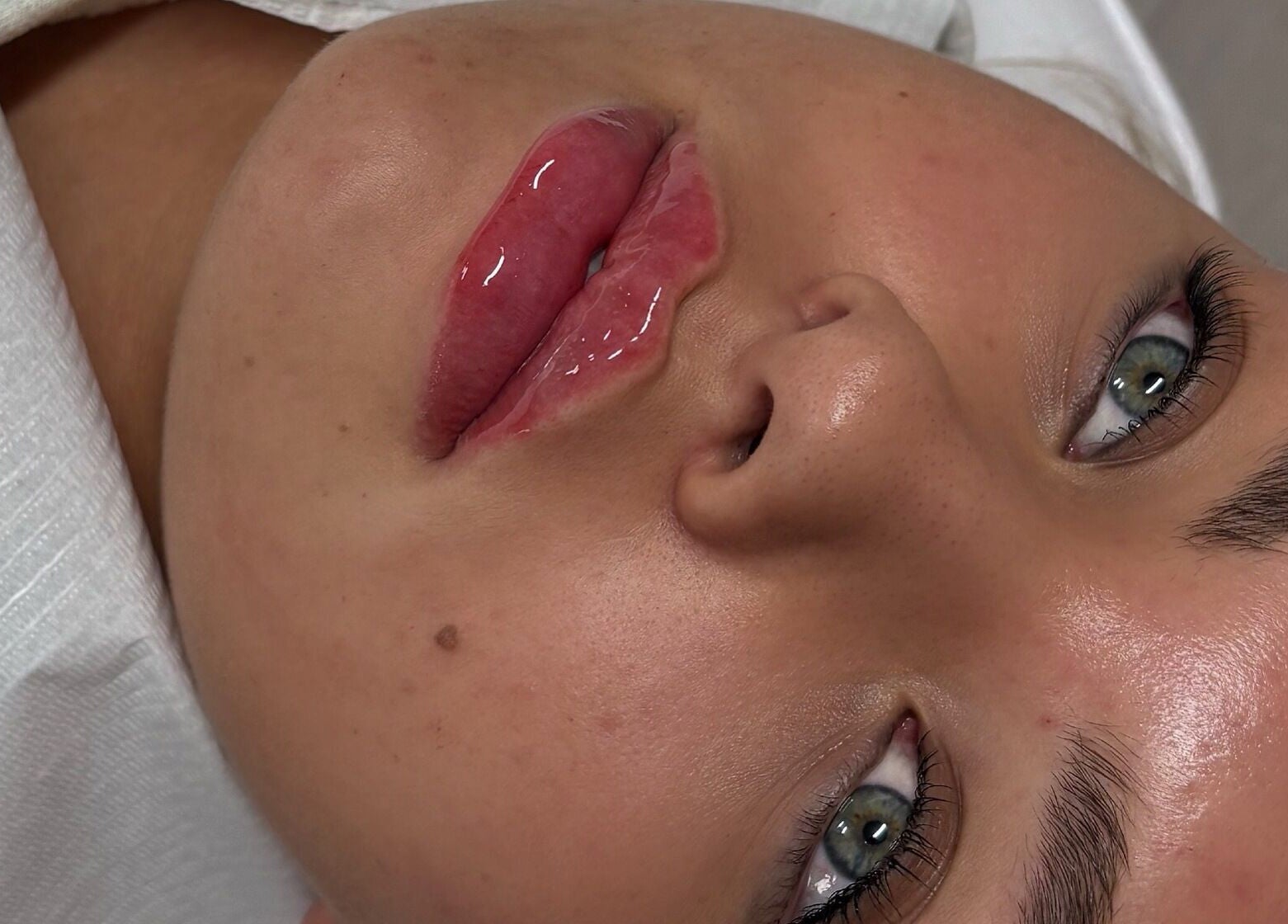 Close-up of glossy lips after treatment at Sculpt Nails & Aesthetics, Warrington, England, GB.