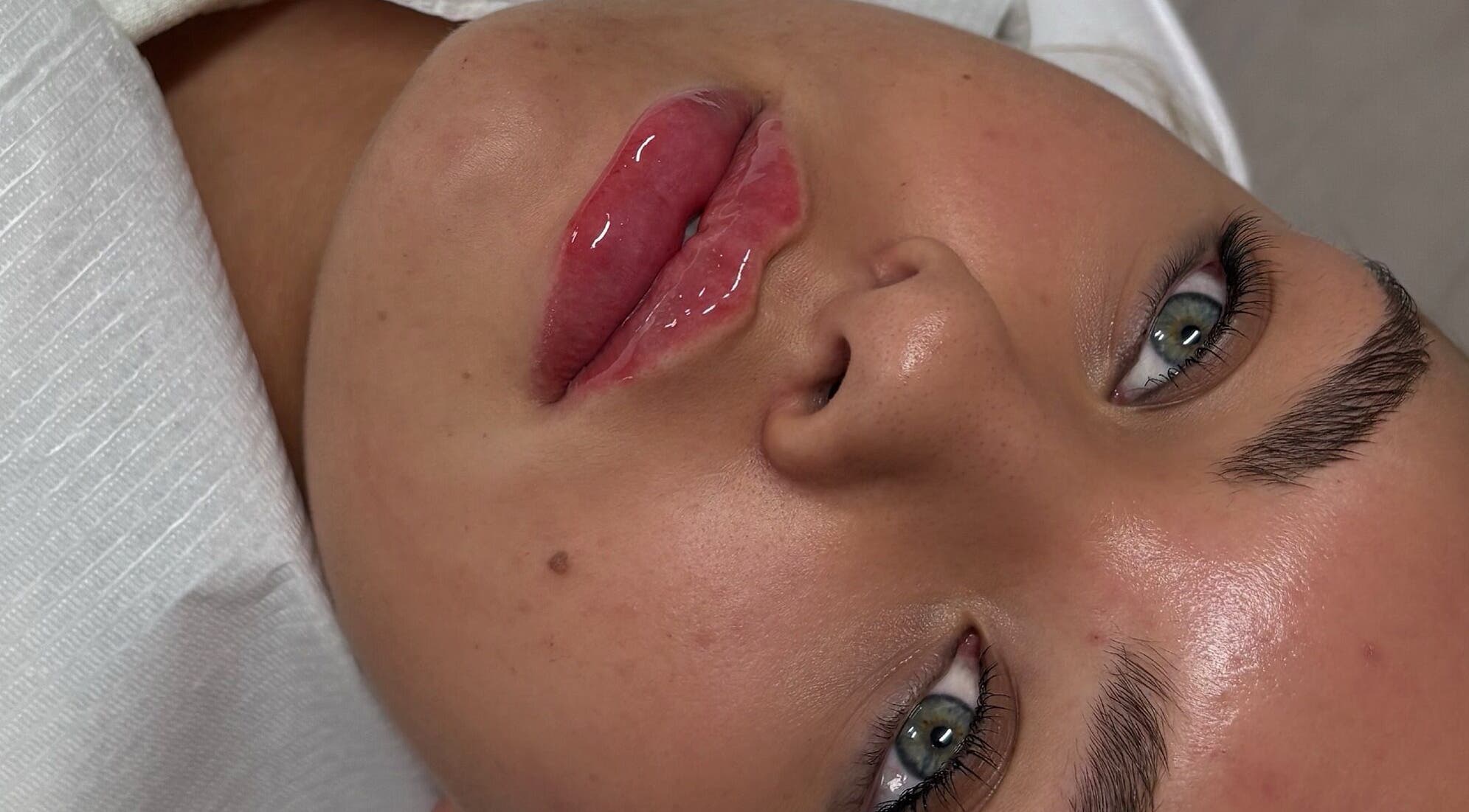 Close-up of glossy lips after treatment at Sculpt Nails & Aesthetics, Warrington, England, GB.