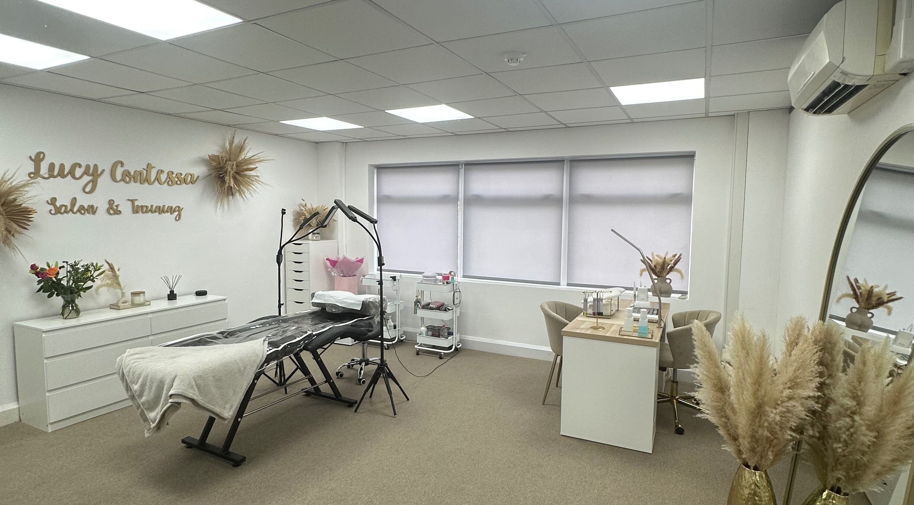 Inside Lucy Contessa Salon & Training in Knaphill, England, featuring modern decor and beauty equipment.