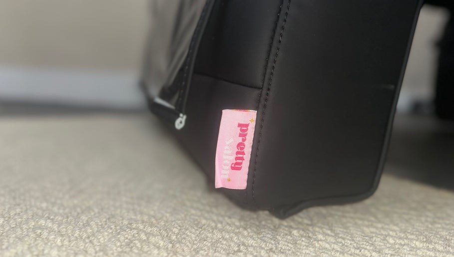 Close-up of 'Pretty' tag on a stylish bag at The Pretty Parlour, Gloucester, England, GB.