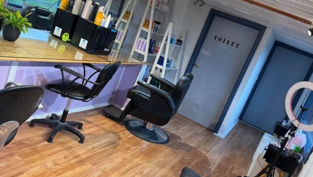 Spacious interior of Casey's Hair Studio in Melbourne, Victoria, AU, showcasing modern salon chairs and styling stations.