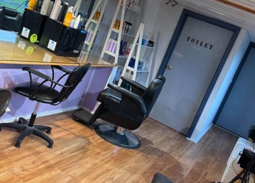Spacious interior of Casey's Hair Studio in Melbourne, Victoria, AU, showcasing modern salon chairs and styling stations.