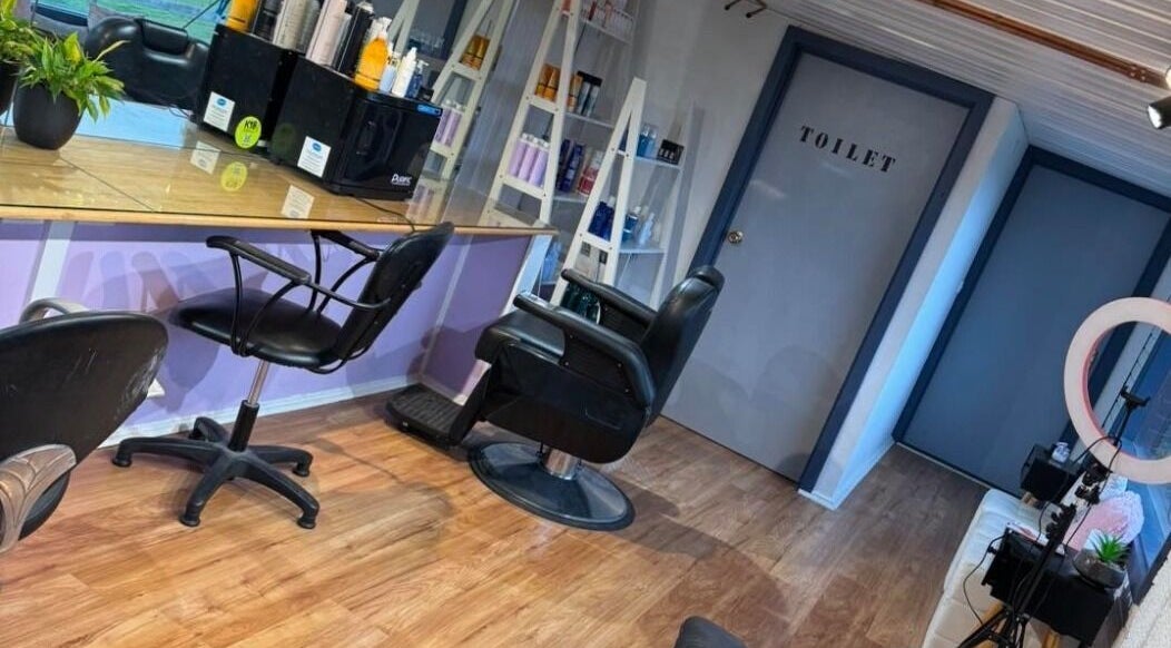 Spacious interior of Casey's Hair Studio in Melbourne, Victoria, AU, showcasing modern salon chairs and styling stations.