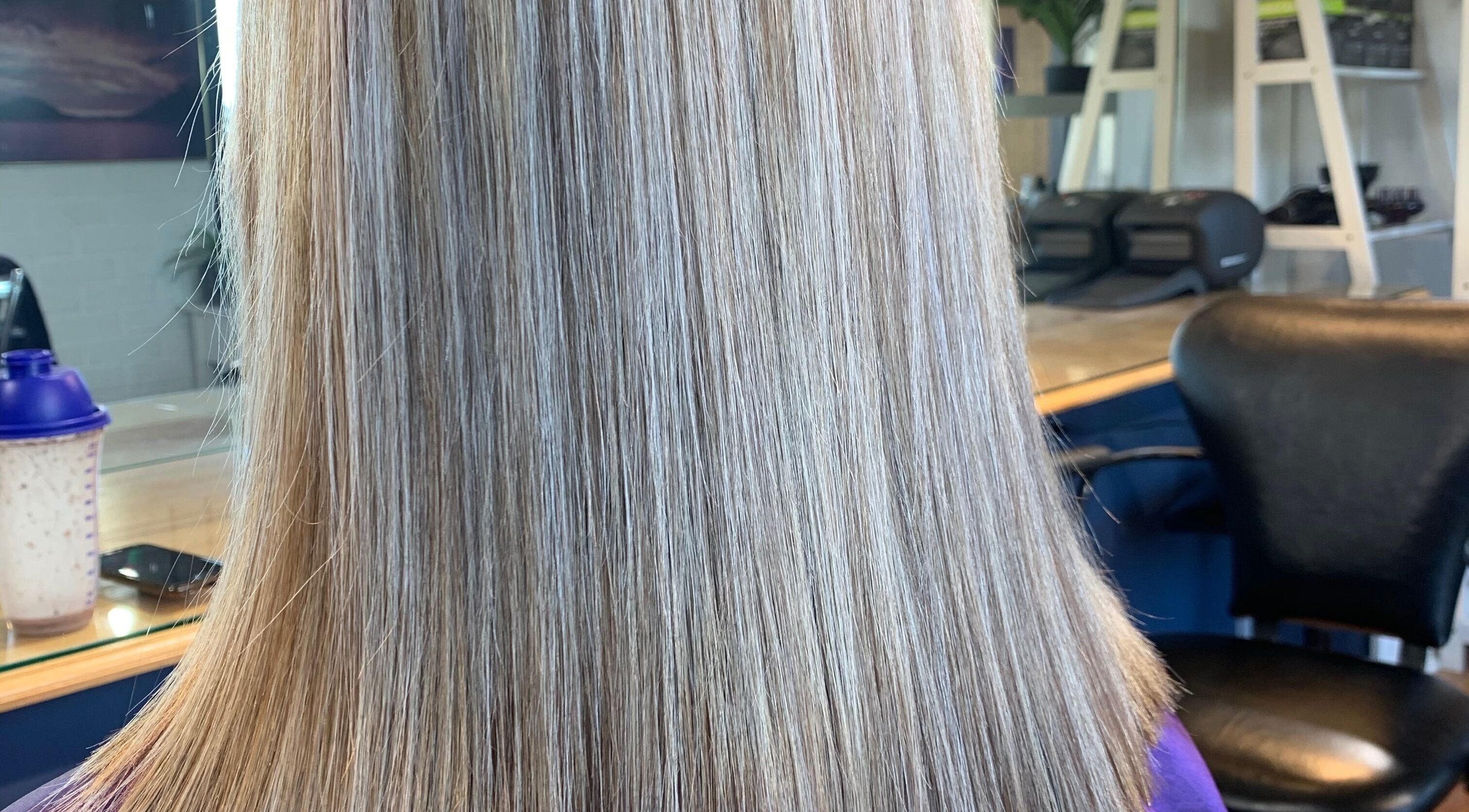 Sleek blonde hair styled at Casey’s Hair Studio, Melbourne, Victoria, AU.