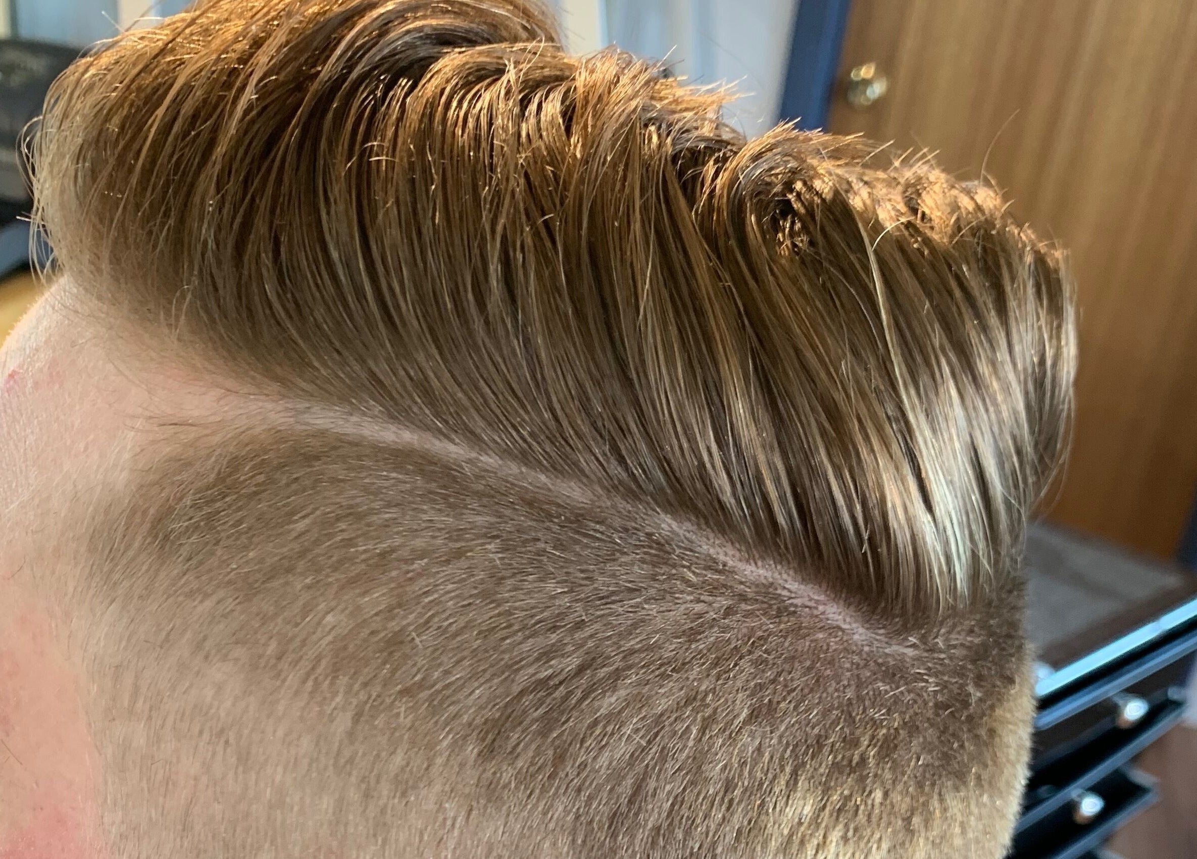 Close-up of a stylish undercut hairstyle at Casey’s Hair Studio in Melbourne, Victoria, AU.
