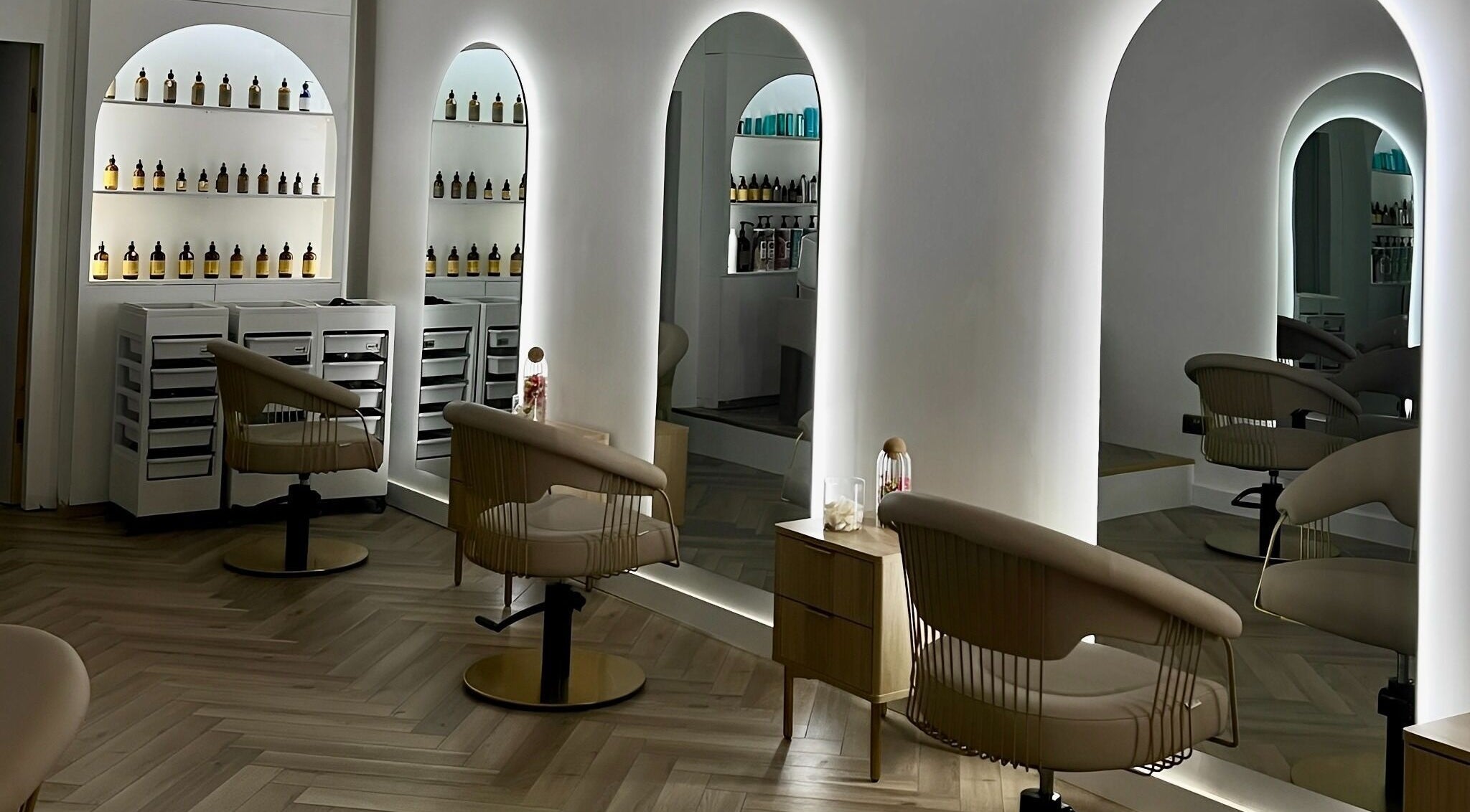 Modern salon interior with elegant chairs at Sassy's Hair & Co, Albrighton, England, GB.