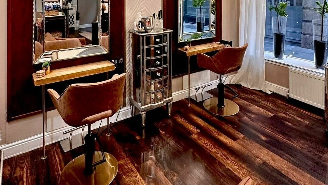 Elegant interior of David Sebastian salon in Derby, England, GB with stylish chairs and mirrors.