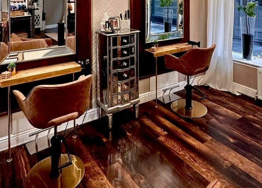 Elegant interior of David Sebastian salon in Derby, England, GB with stylish chairs and mirrors.