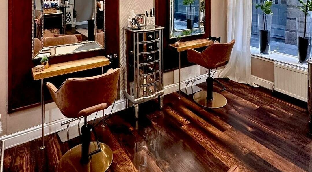Elegant interior of David Sebastian salon in Derby, England, GB with stylish chairs and mirrors.