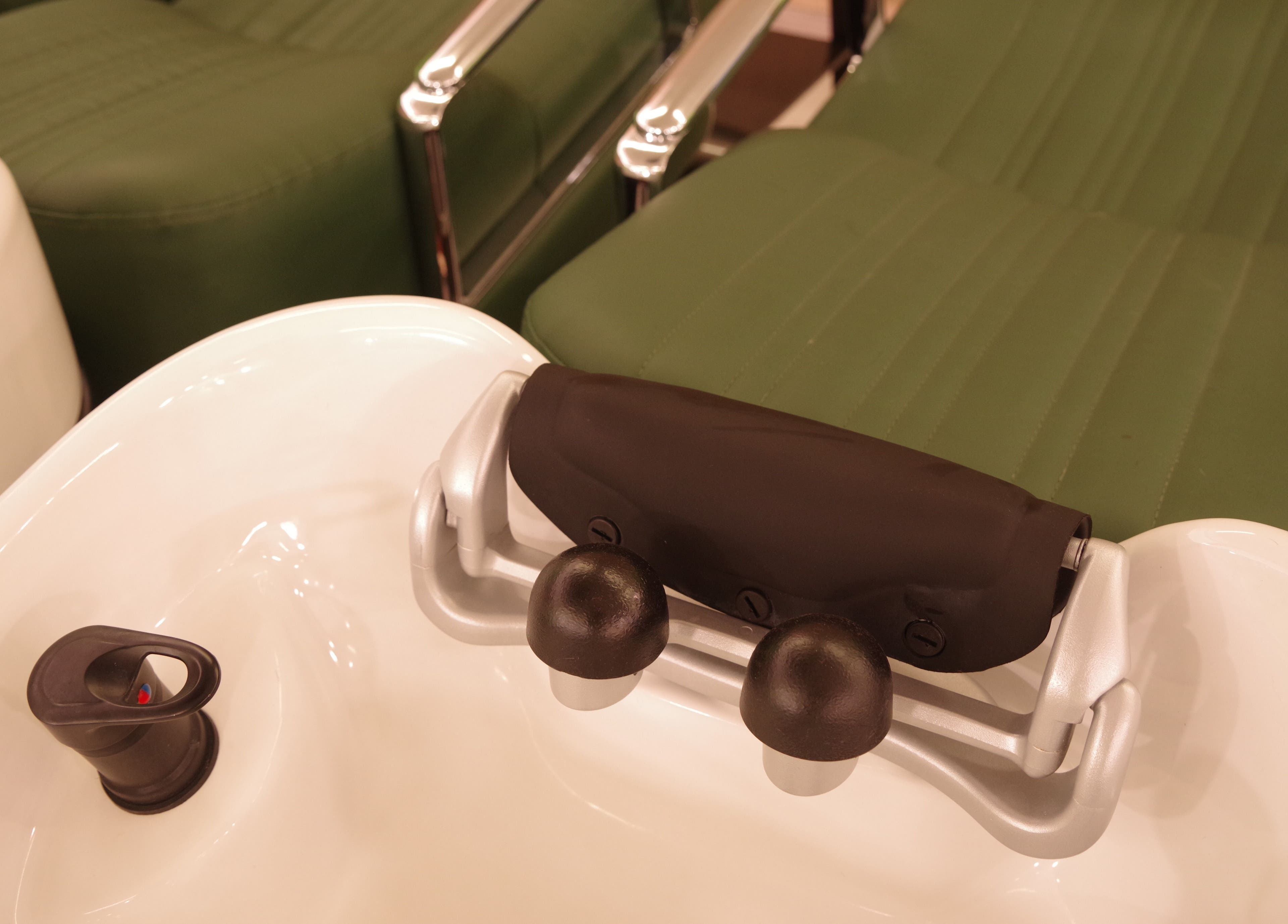 Pedicure station at Causeway Bay Branch with green chairs, located in Hong Kong Island, Hong Kong Island, HK.