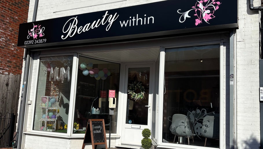 Front view of Beauty Within in Gosport, England, showcasing modern glass and elegant signage.