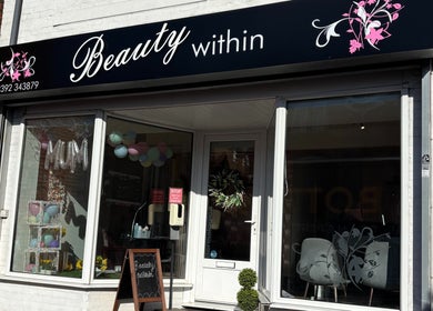 Front view of Beauty Within in Gosport, England, showcasing modern glass and elegant signage.