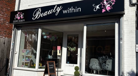 Front view of Beauty Within in Gosport, England, showcasing modern glass and elegant signage.