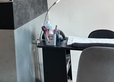 Beauty Within's treatment area in Gosport, England, GB with tools on a sleek black table.