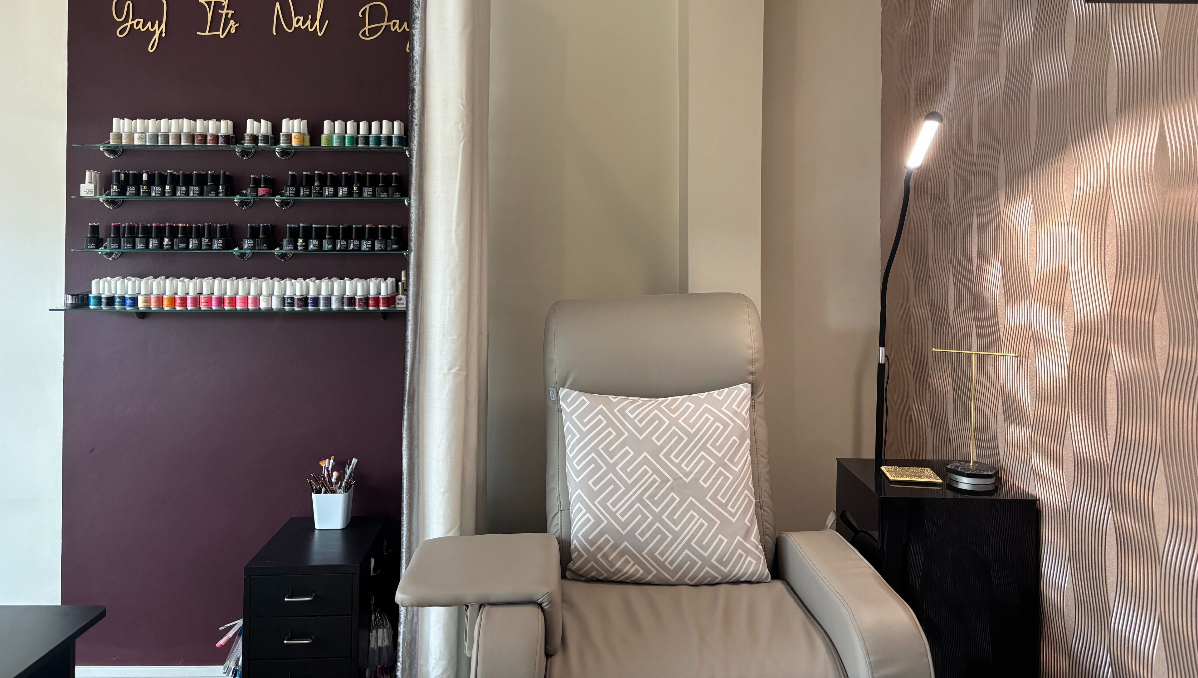 Luxurious nail lounge at Beauty Within, Gosport, England. Elegant design with vibrant polish collection.
