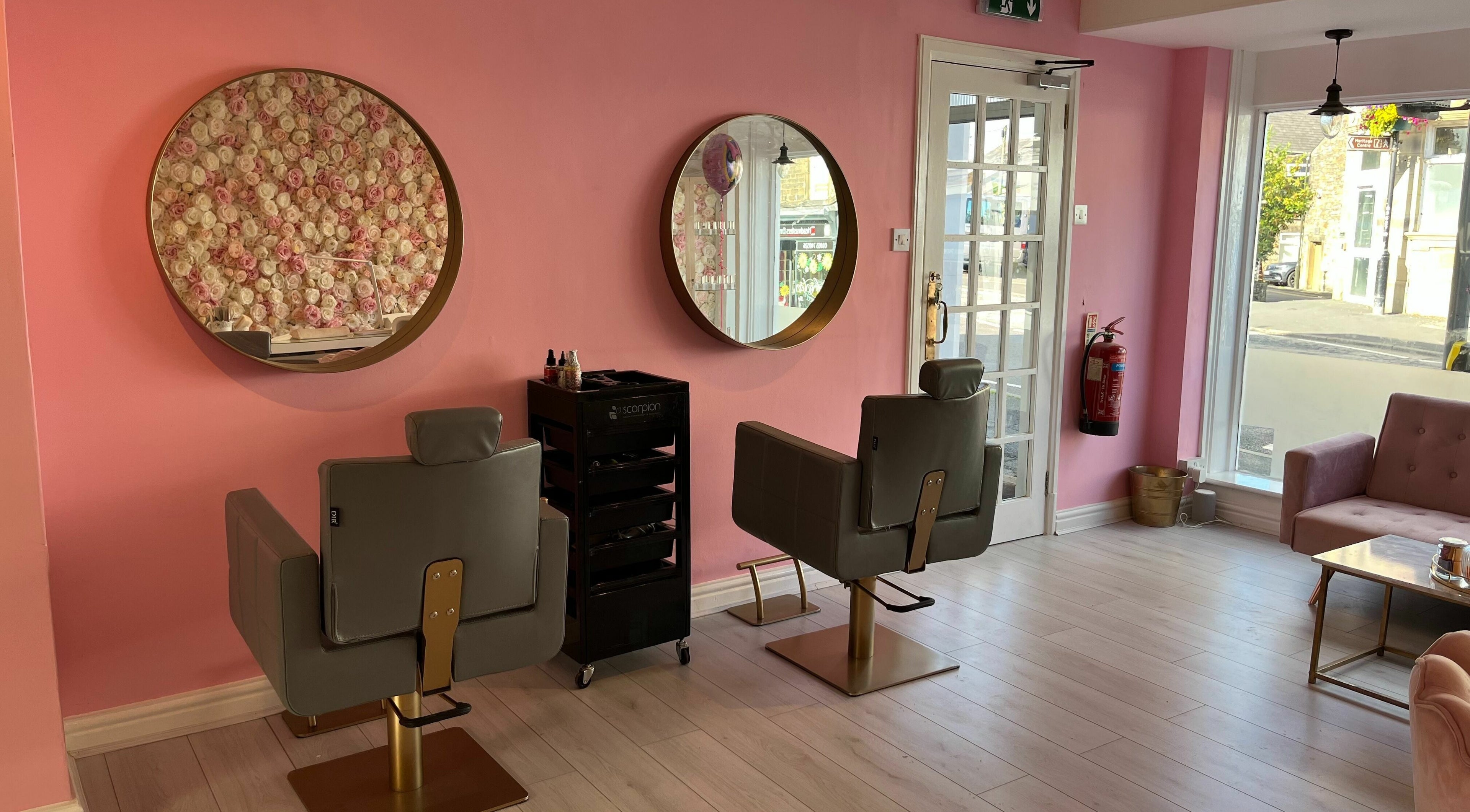 Stylish interior of Luxe Aesthetics Hair and Beauty, New Mills, England, GB with pink decor and modern furnishings.