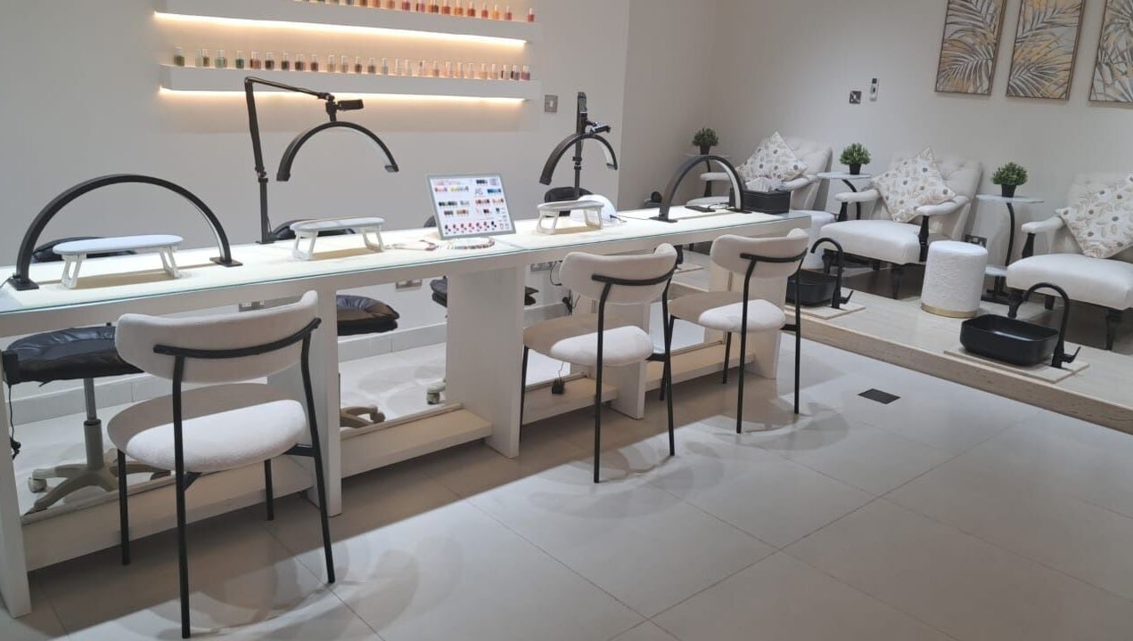 Elegant nail salon at Evano Spa Ladies, Al Ain, Abu Dhabi, AE, featuring chic manicure and pedicure stations.