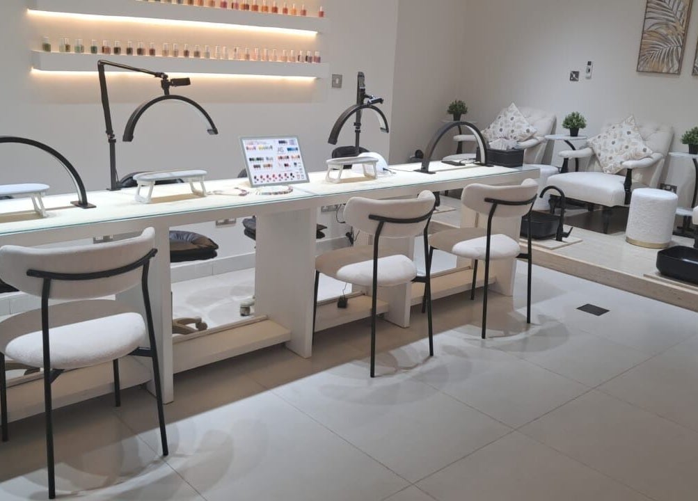 Elegant nail salon at Evano Spa Ladies, Al Ain, Abu Dhabi, AE, featuring chic manicure and pedicure stations.