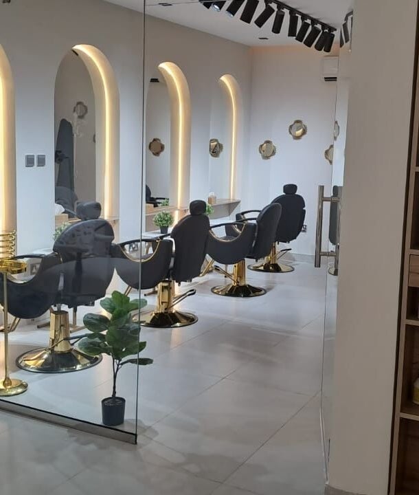 Elegant salon chairs and mirrors at Evano Spa Ladies, Al Ain, Abu Dhabi, AE, offering luxury services.