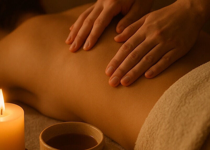 Relaxing massage at Dragonfly Therapy, London, GB, featuring calming candlelight and expert hands.