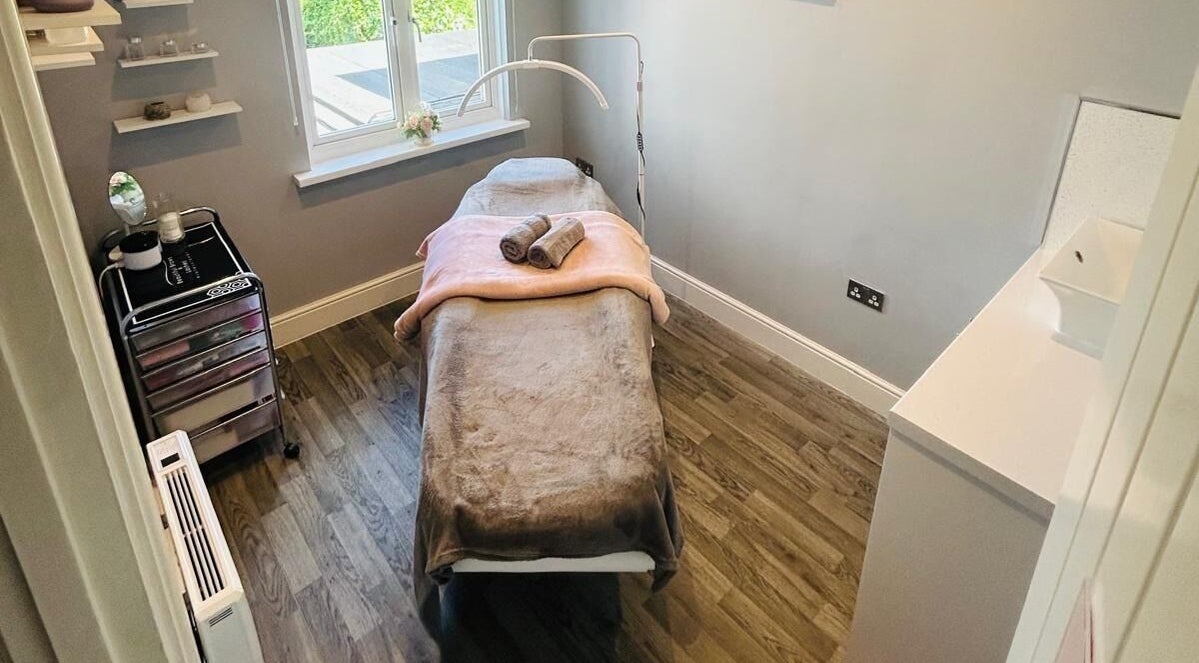 Treatment room at Le Reve, Gravesend, England, GB with massage table and soft lighting, ensuring relaxation.