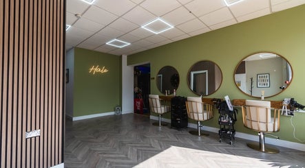 Modern styling area at NR Beauty Lounge, Birtley, England, GB with elegant mirrors and chairs.