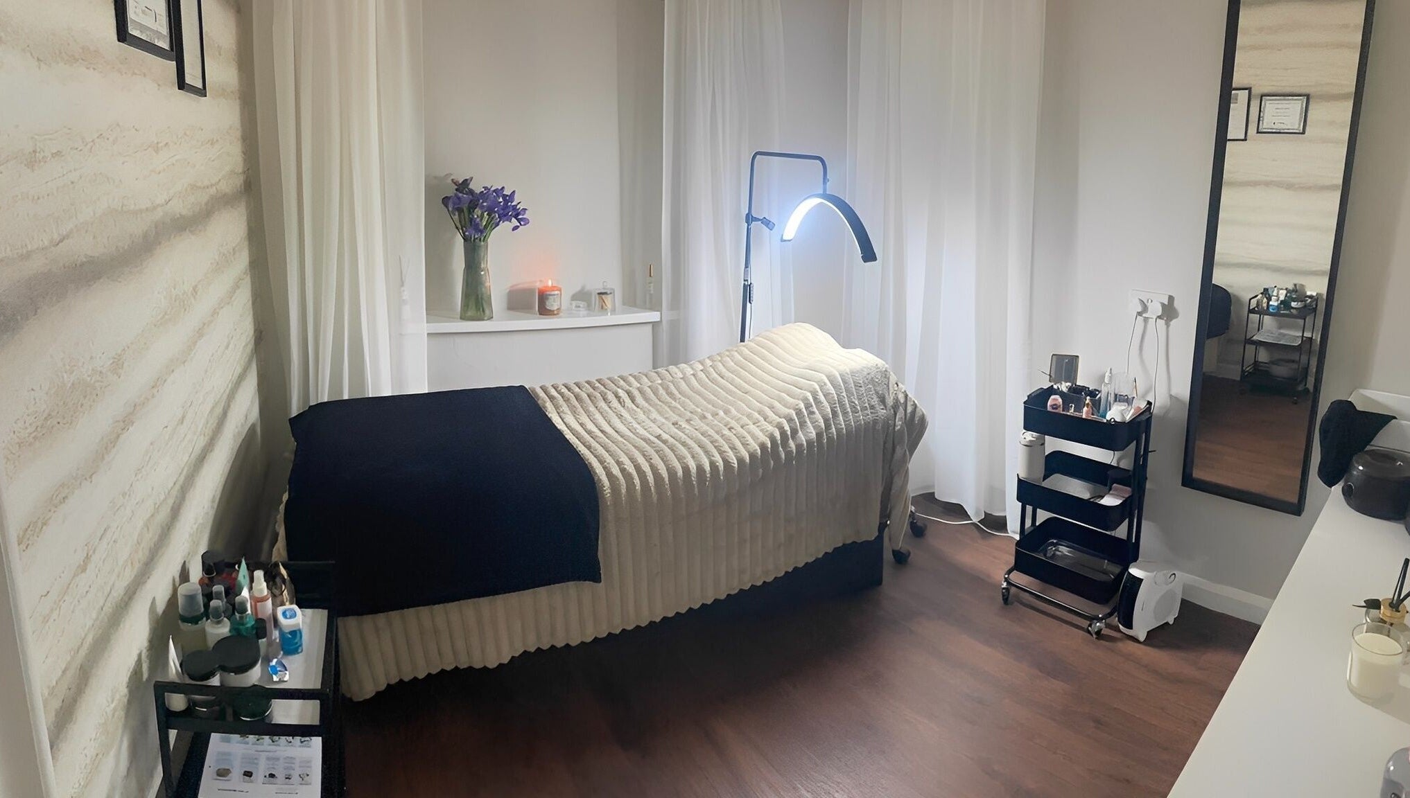 Tranquil treatment room at NR Beauty Lounge, Birtley, England, GB featuring a massage bed with cozy decor.