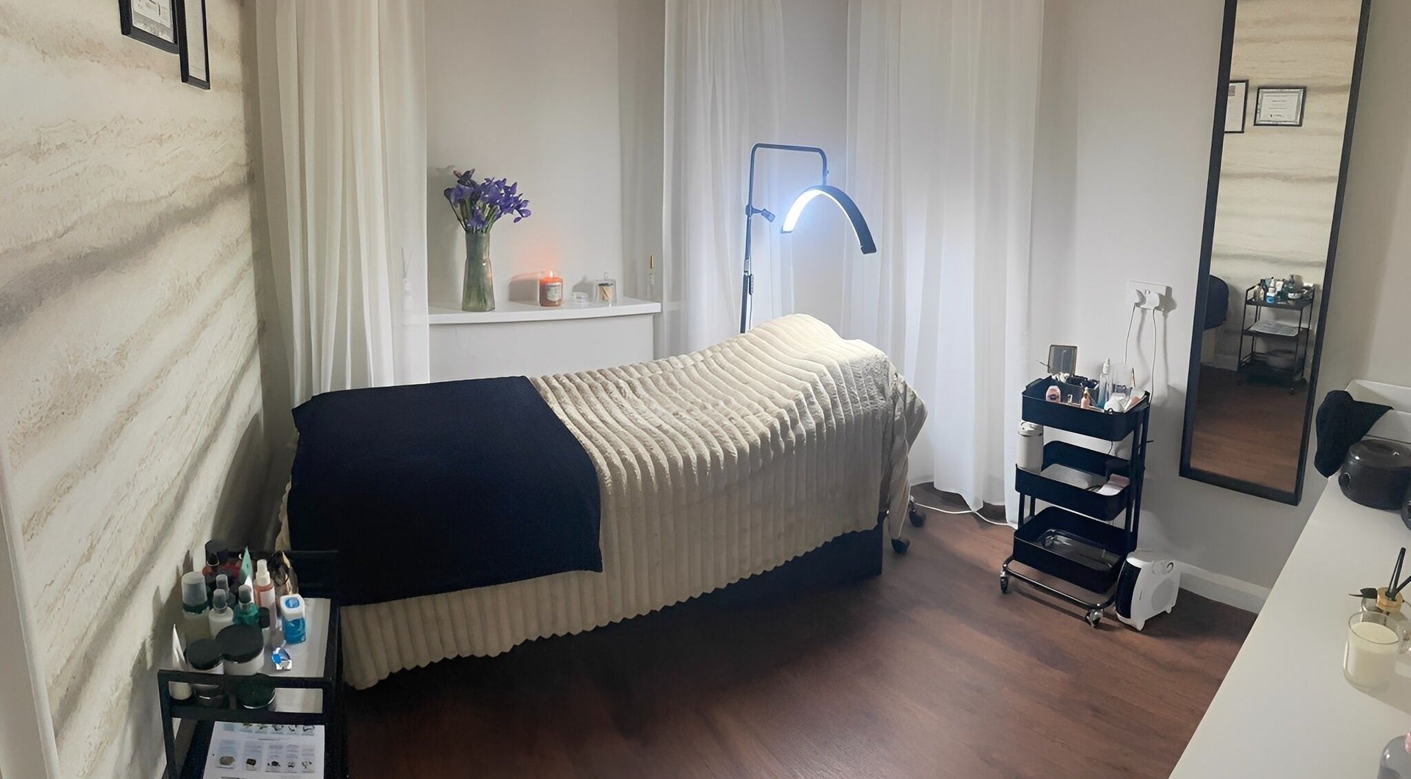 Tranquil treatment room at NR Beauty Lounge, Birtley, England, GB featuring a massage bed with cozy decor.