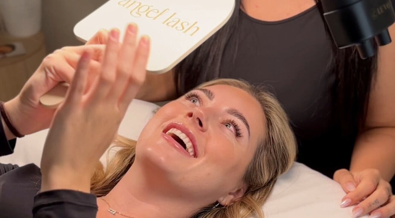 Happy client admires new lashes at Angel Lash, Beaconsfield, Western Australia, AU.