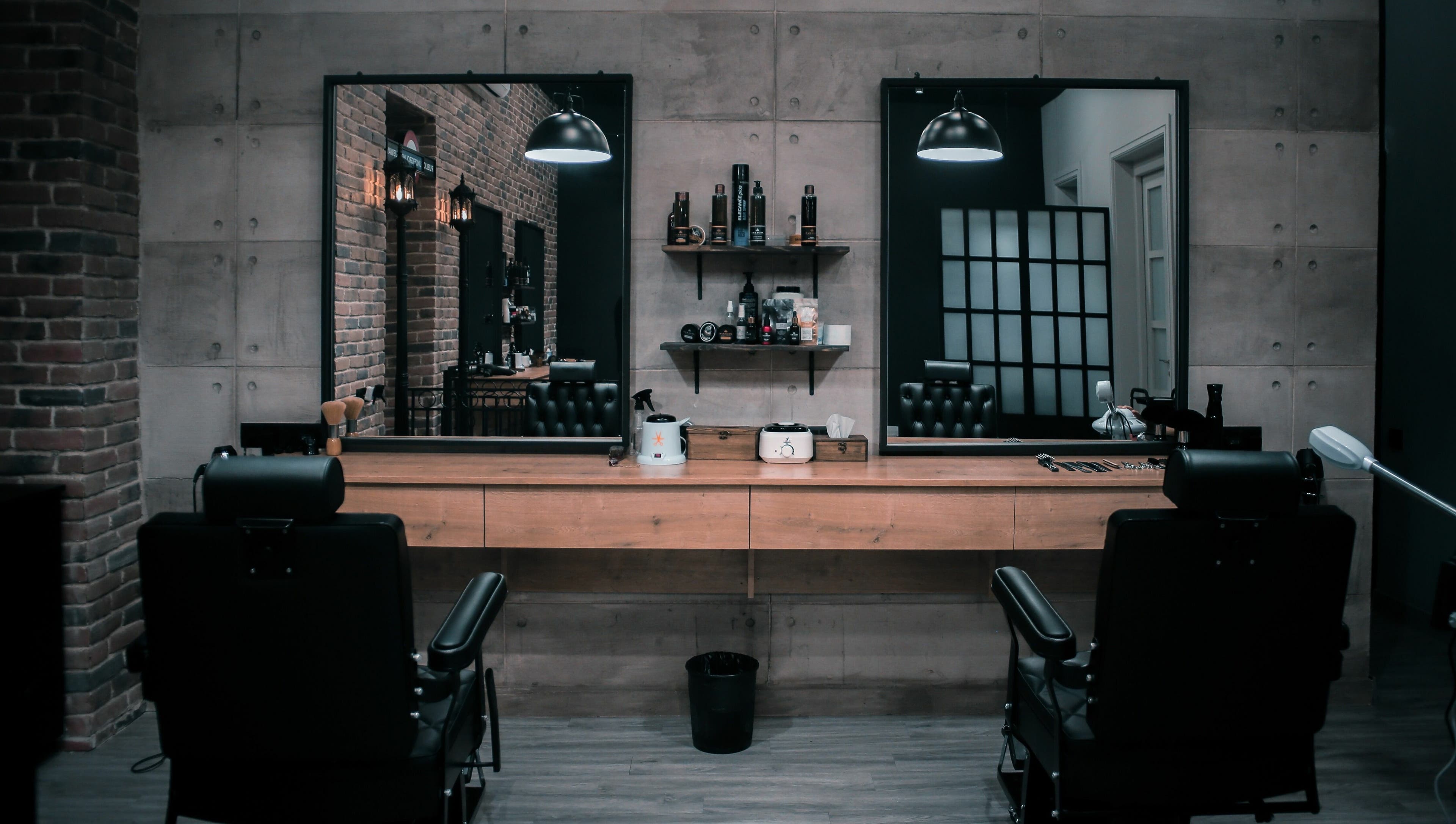 Modern salon interior at Paragon, Yerevan, Yerevan, AM featuring stylish black chairs and mirrors.
