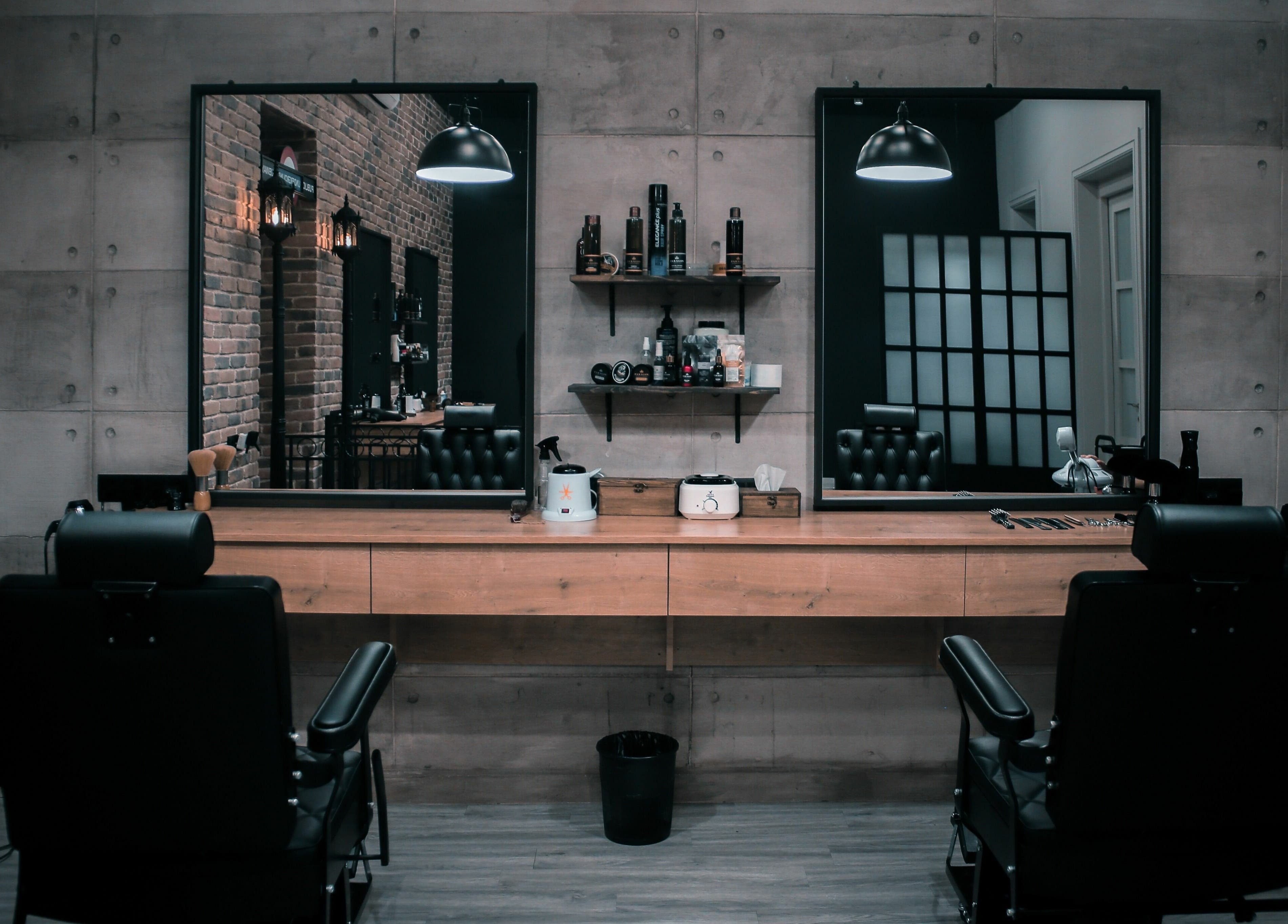 Modern salon interior at Paragon, Yerevan, Yerevan, AM featuring stylish black chairs and mirrors.