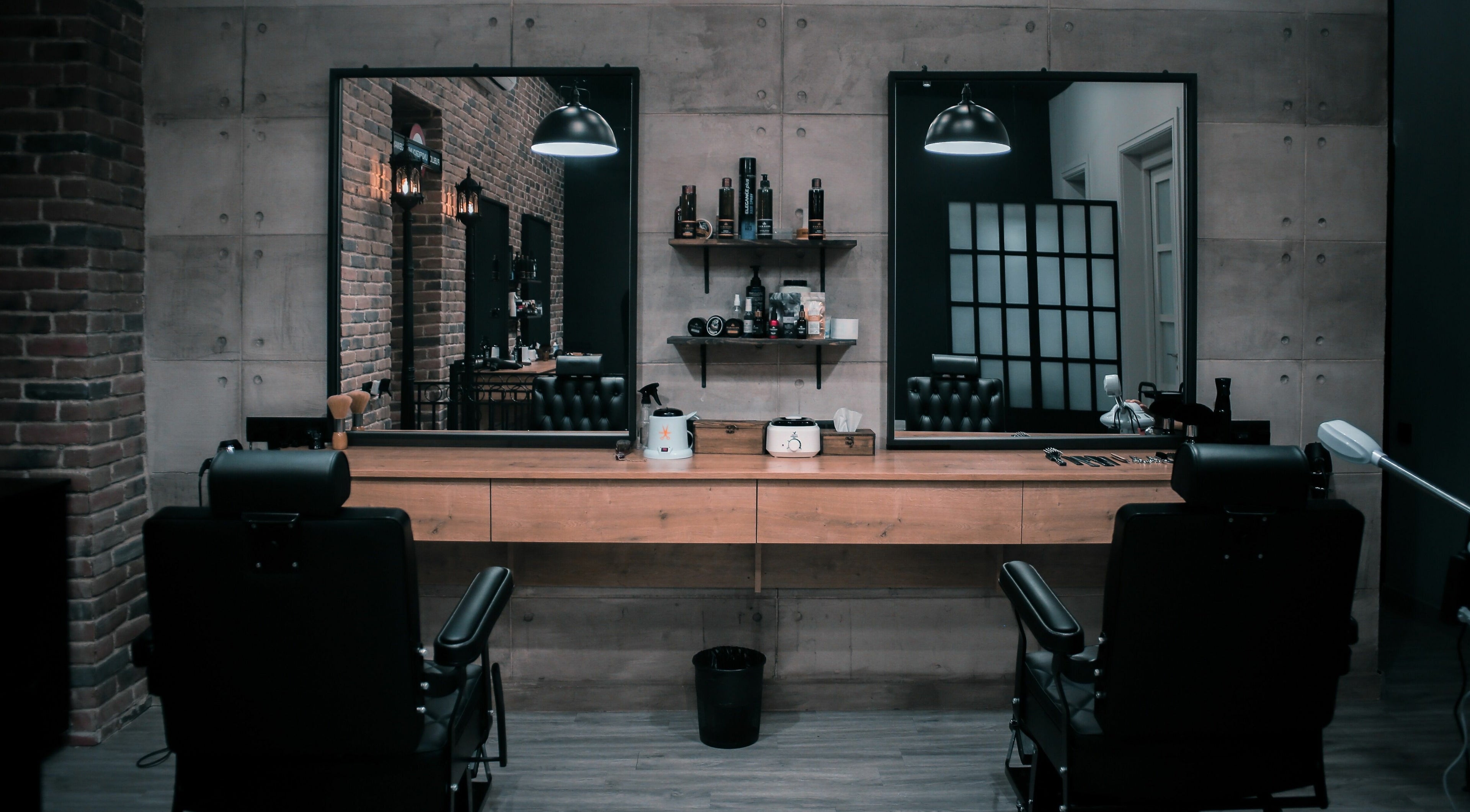 Modern salon interior at Paragon, Yerevan, Yerevan, AM featuring stylish black chairs and mirrors.