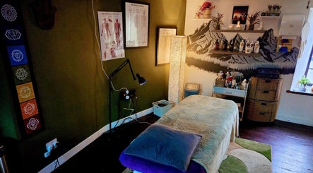 Relaxing therapy room at Macroom Massage and Holistic Clinic, County Cork, IE, with cozy decor and soothing lighting.