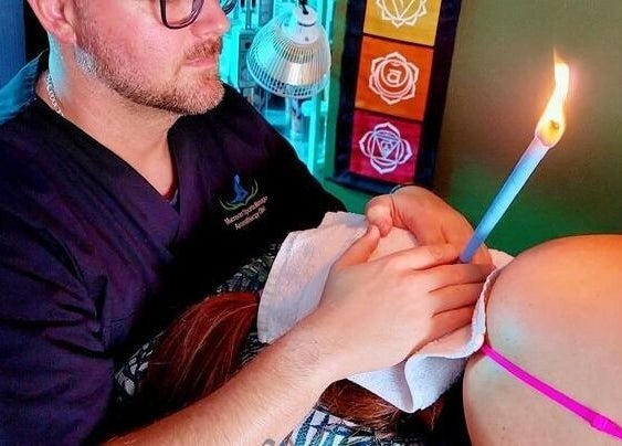 Ear candling therapy session at Macroom Massage and Holistic Clinic, County Cork, County Cork, IE.