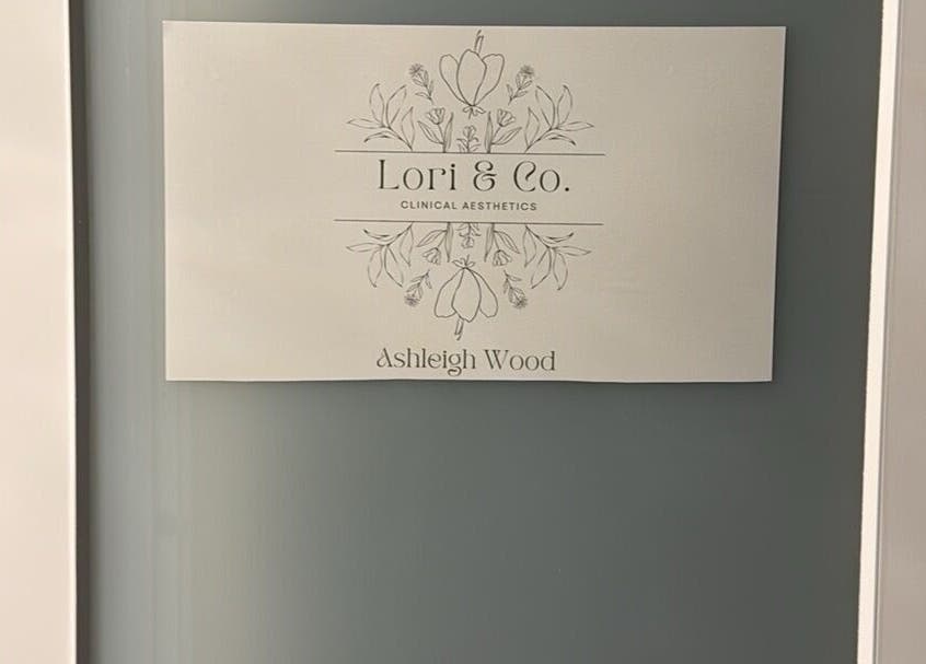 Elegant sign for Lori & Co. Clinical Aesthetics in Melbourne, Victoria, AU featuring decorative floral design.